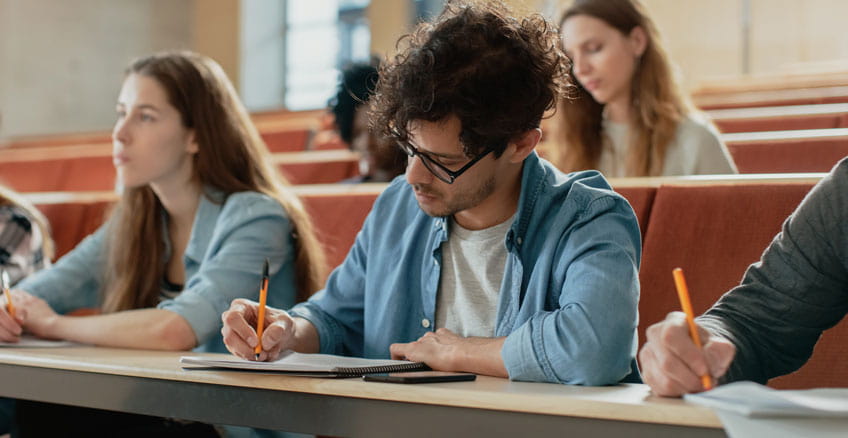 Student taking notes